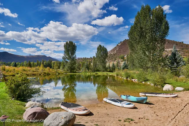 a view of a lake with houses with outdoor space