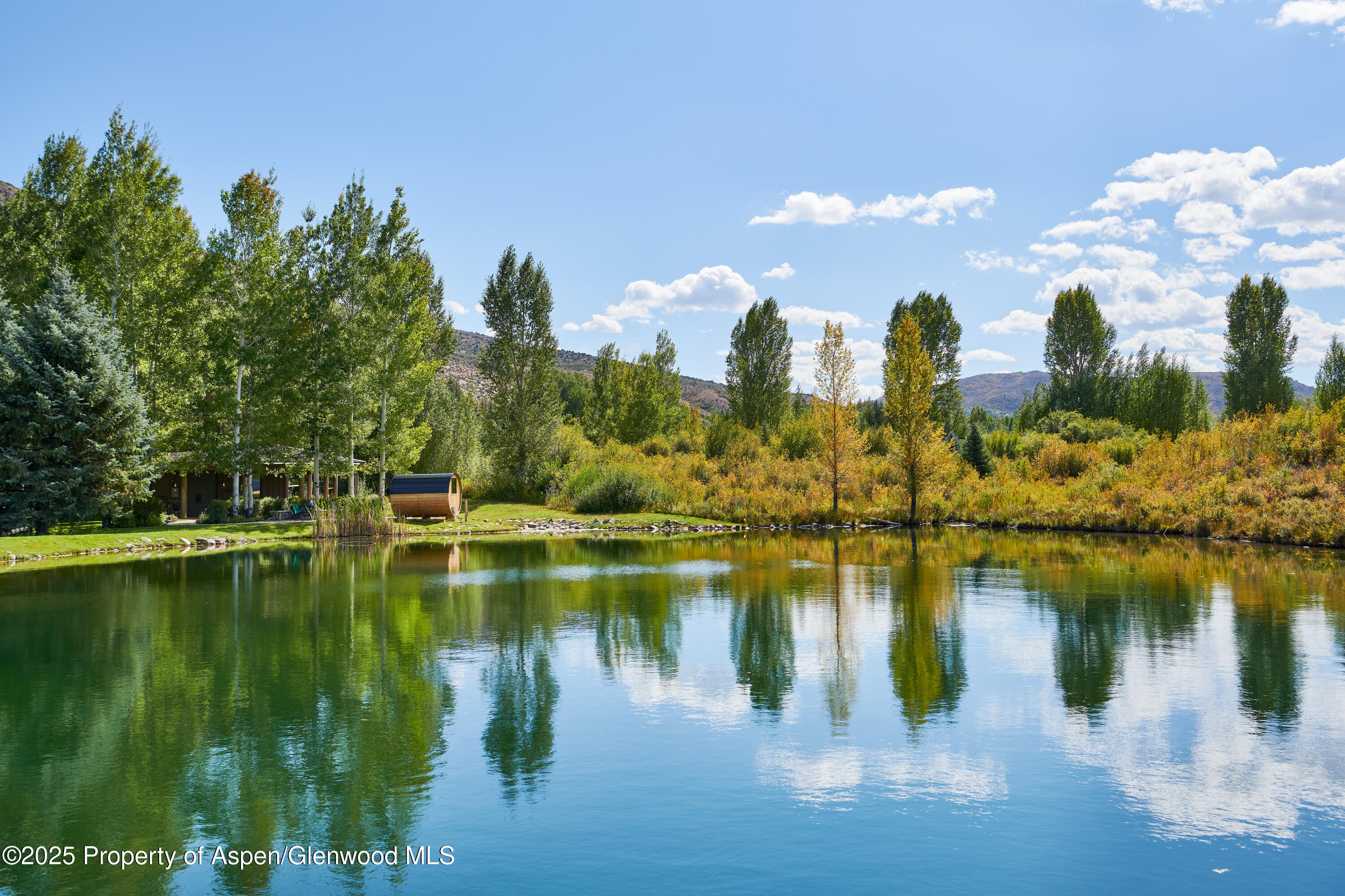 1900-1902 Snowmass Creek Road Snowmass, CO 81654 - Photo 34 of 74 a view of a lake with houses