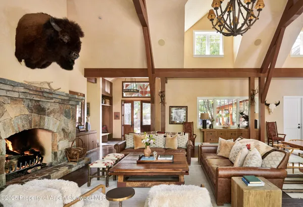 a living room with furniture fireplace and flat screen tv