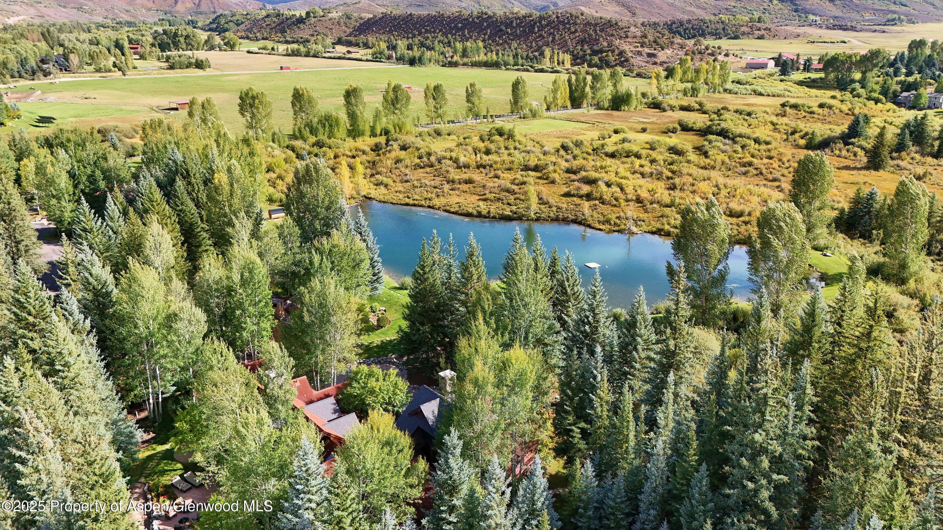 1900-1902 Snowmass Creek Road Snowmass, CO 81654 - Photo 52 of 74 a view of a lake with a mountain