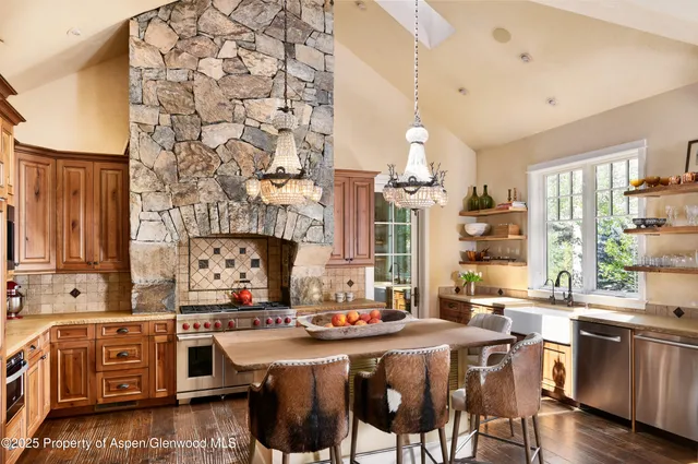 a front view of a house with a trees