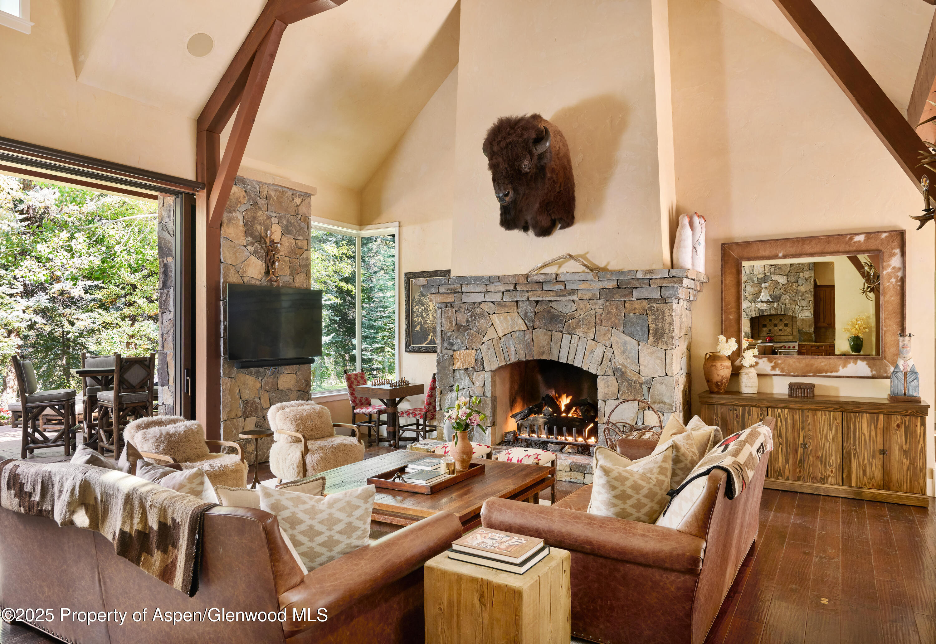 1900-1902 Snowmass Creek Road Snowmass, CO 81654 - Photo 9 of 74 a living room with furniture fireplace and flat screen tv