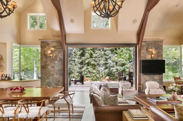 a view of backyard with swimming pool and outdoor seating