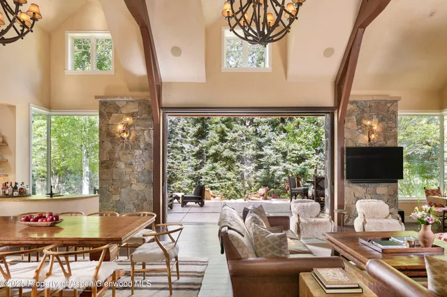 a view of backyard with swimming pool and outdoor seating