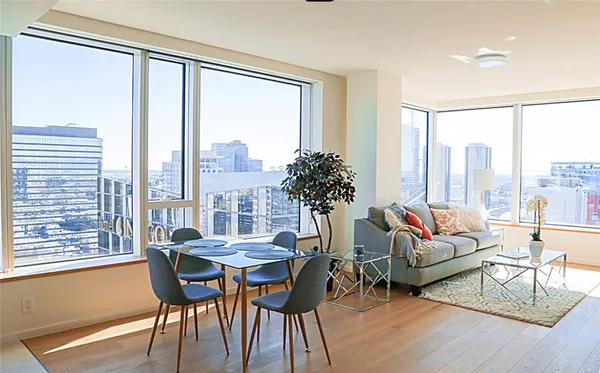 a living room with furniture and a large window