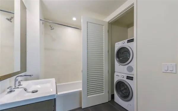 a view of a hallway with washer and dryer