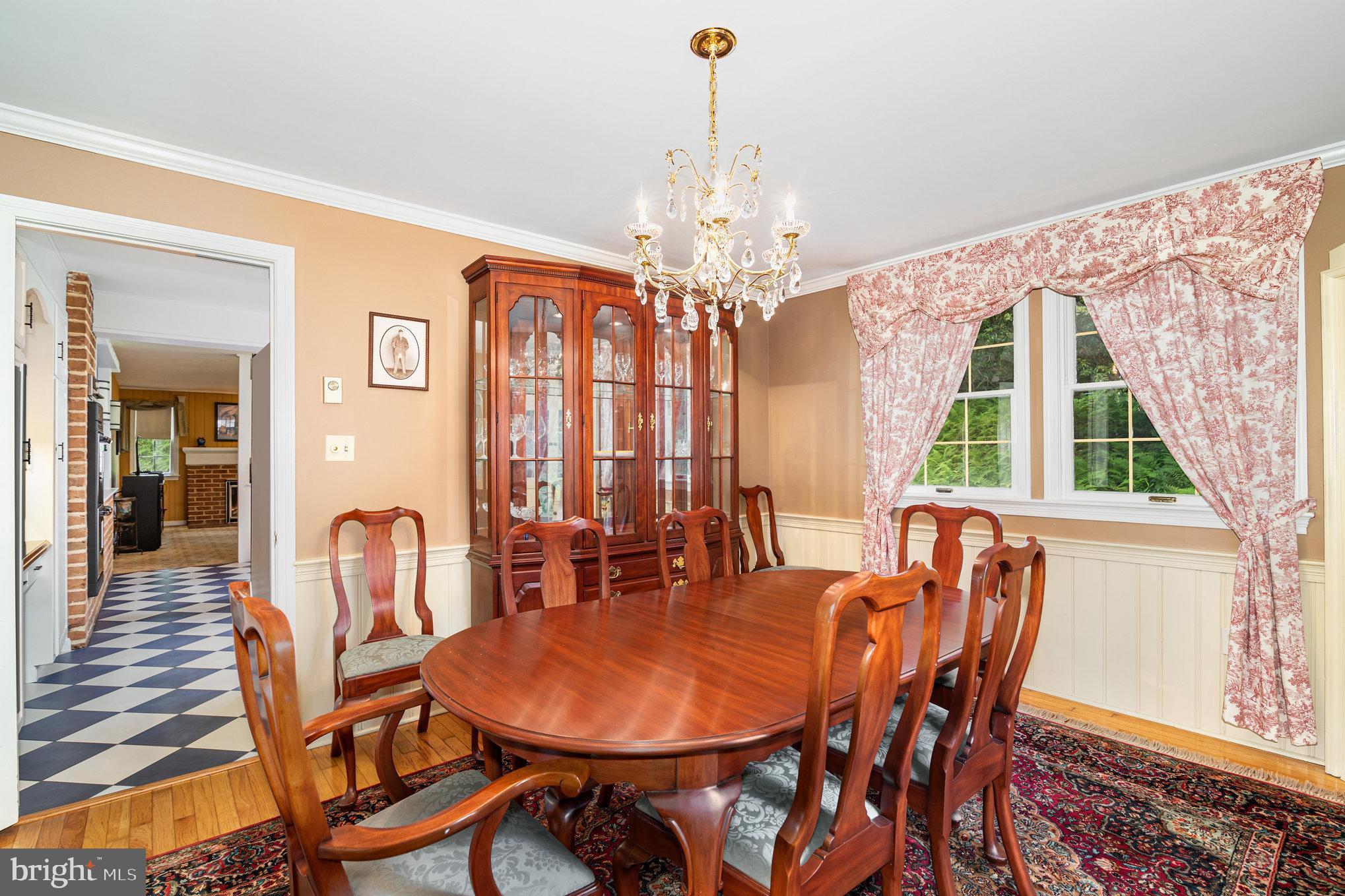 2221 Mockingbird Road Harrisburg, PA 17112 - Photo 11 of 35 a dining room with furniture a chandelier and wooden floor