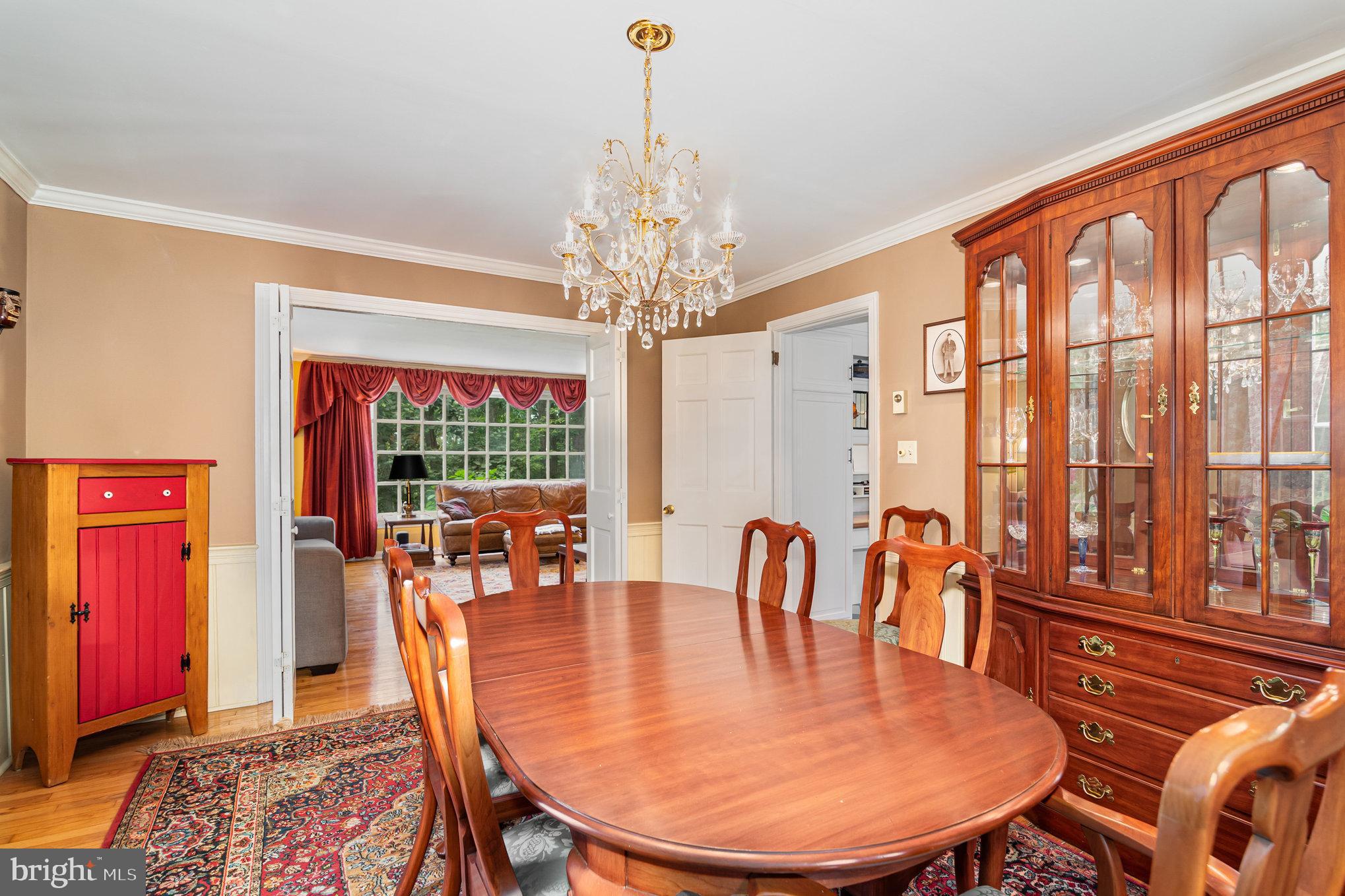 2221 Mockingbird Road Harrisburg, PA 17112 - Photo 12 of 35 a dining room with furniture a chandelier and wooden floor