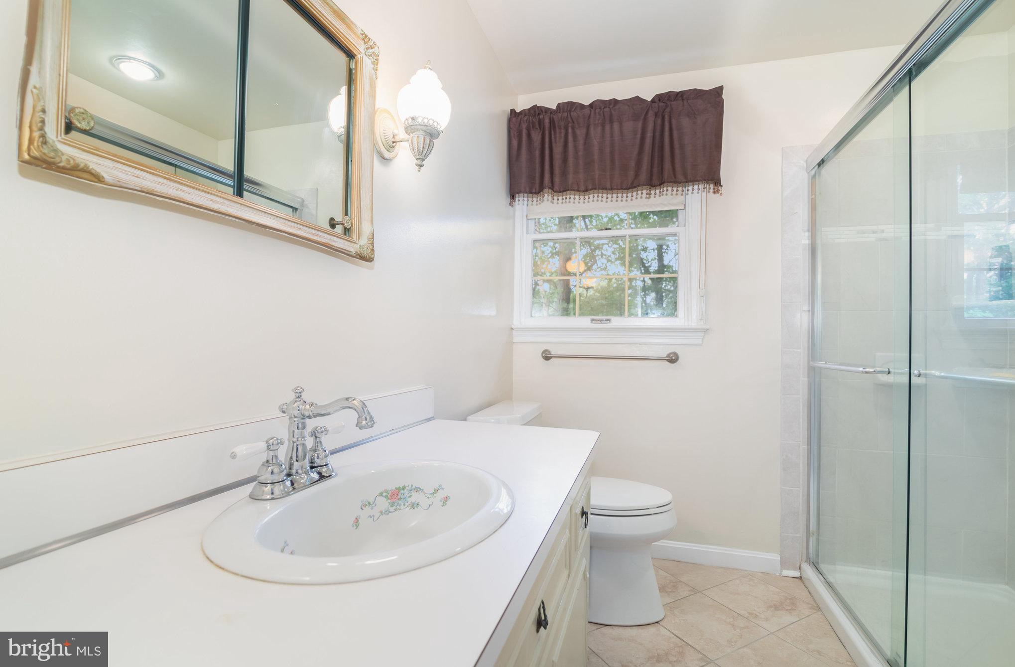 2221 Mockingbird Road Harrisburg, PA 17112 - Photo 23 of 35 a bathroom with a sink a toilet and shower