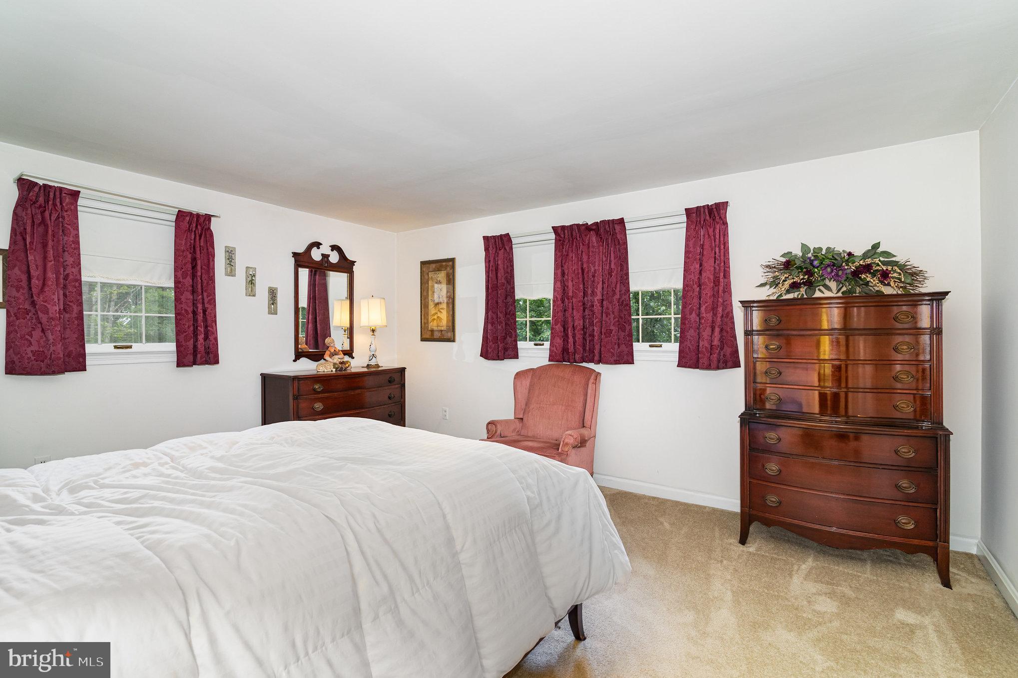 2221 Mockingbird Road Harrisburg, PA 17112 - Photo 26 of 35 a bedroom with a bed dresser and a window
