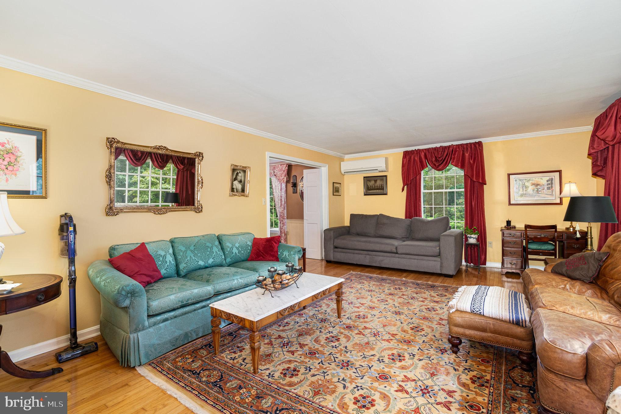 2221 Mockingbird Road Harrisburg, PA 17112 - Photo 6 of 35 a living room with furniture ceiling fan and a rug