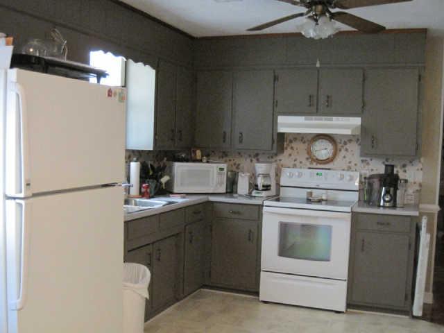 3105 Big Springs Road Lebanon, TN 37090 - Photo 6 of 14 a kitchen with a sink a stove and refrigerator