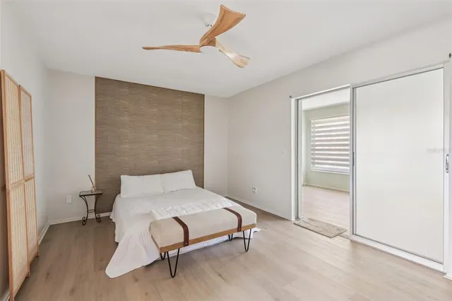 a bedroom with a bed and a cabinets