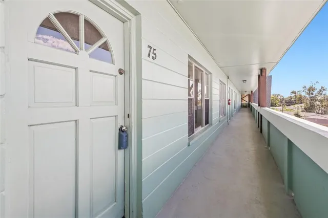 a hallway with a washer and dryer