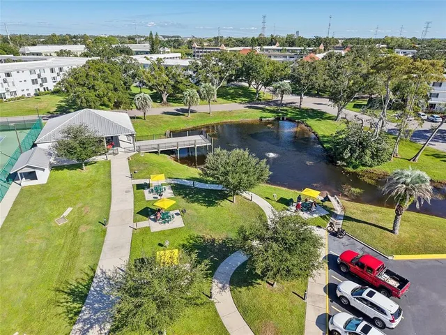 an aerial view of a house with a swimming pool