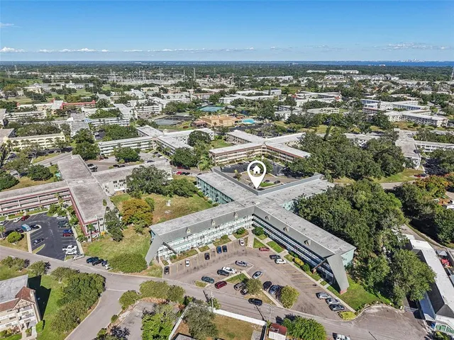 an aerial view of residential building with parking space