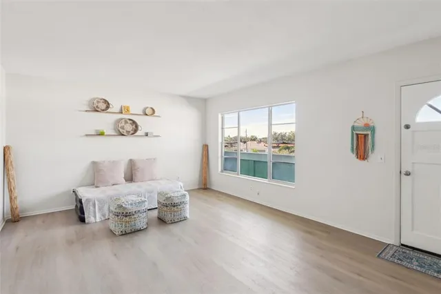 a room with a bed and a large window