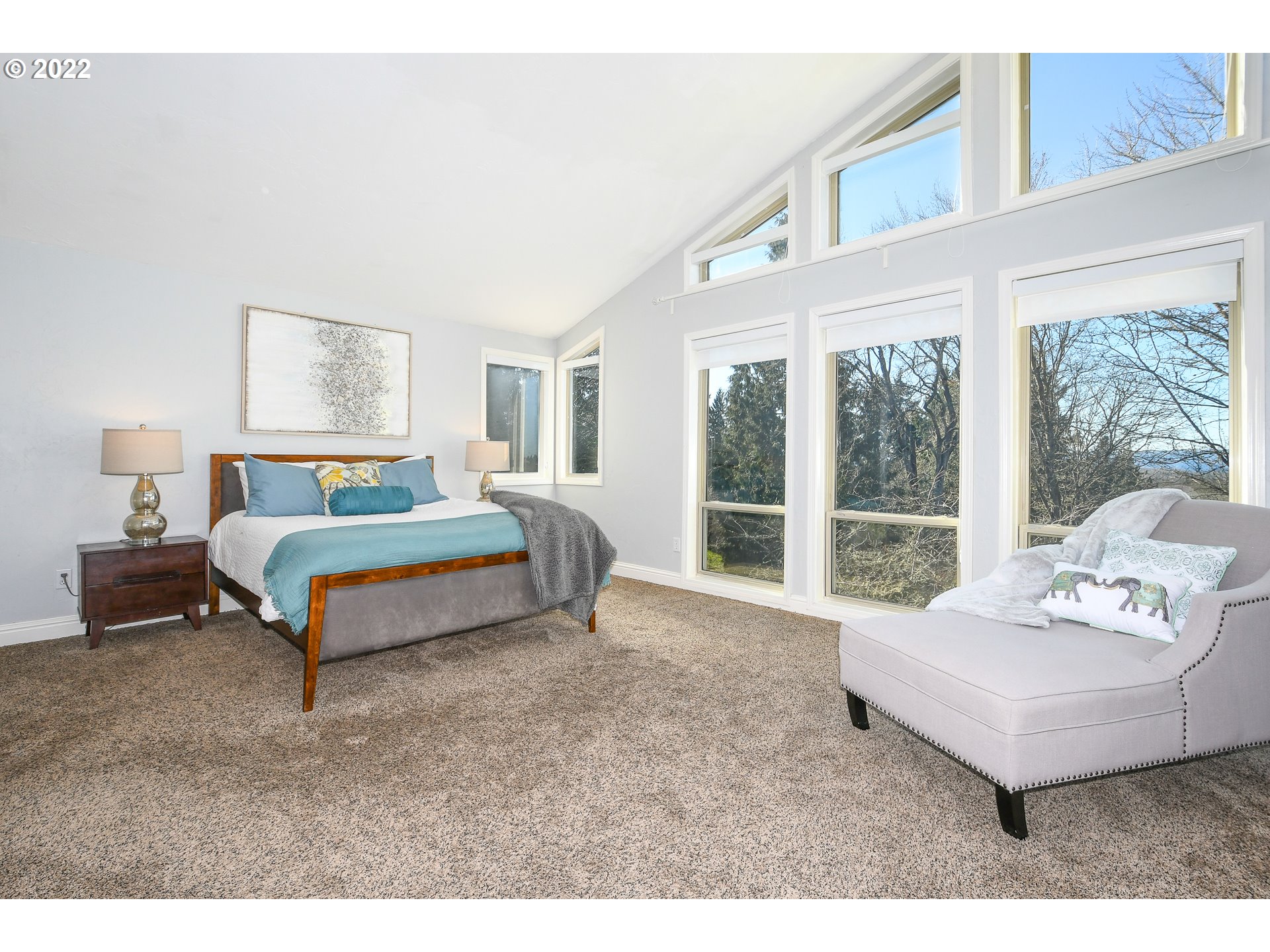 18604 Northwest 64th Avenue Ridgefield, WA 98642 - Photo 15 of 32 a spacious bedroom with a bed and a large window