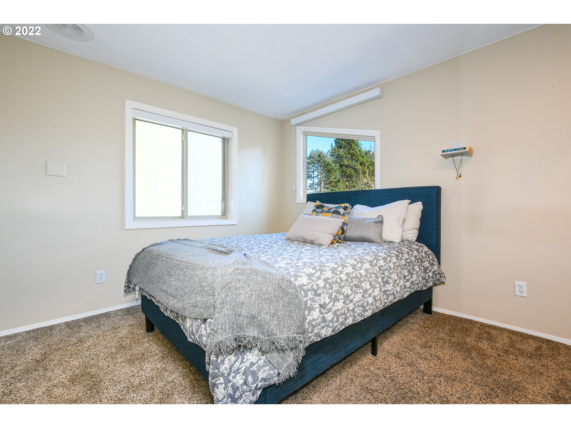 18604 Northwest 64th Avenue Ridgefield, WA 98642 - Photo 20 of 32 a bedroom with a bed and window