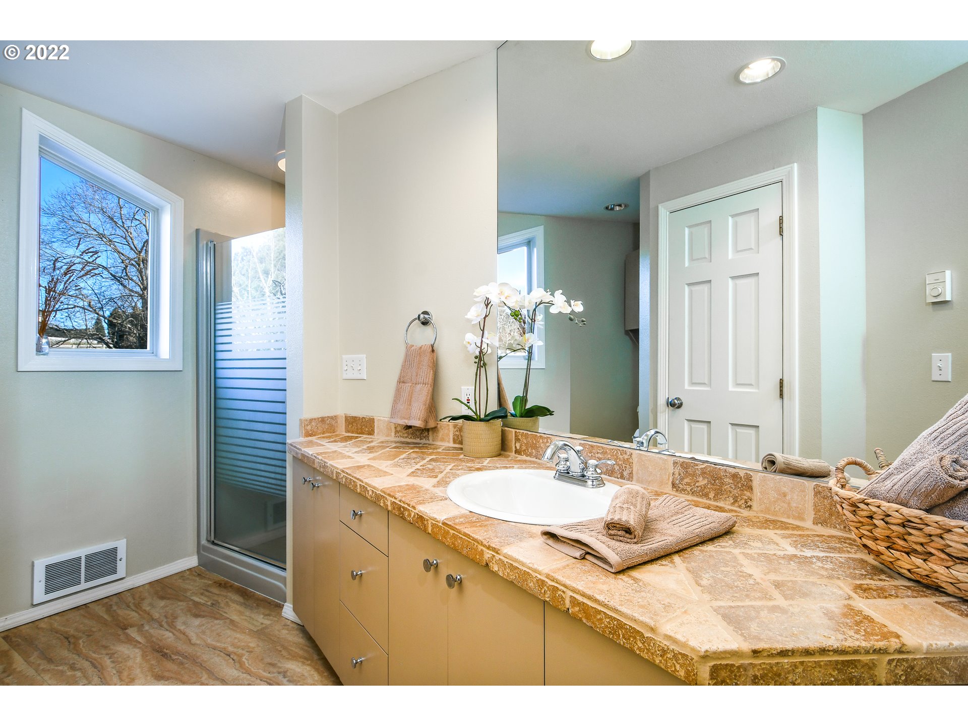 18604 Northwest 64th Avenue Ridgefield, WA 98642 - Photo 21 of 32 a bathroom with a sink and a mirror