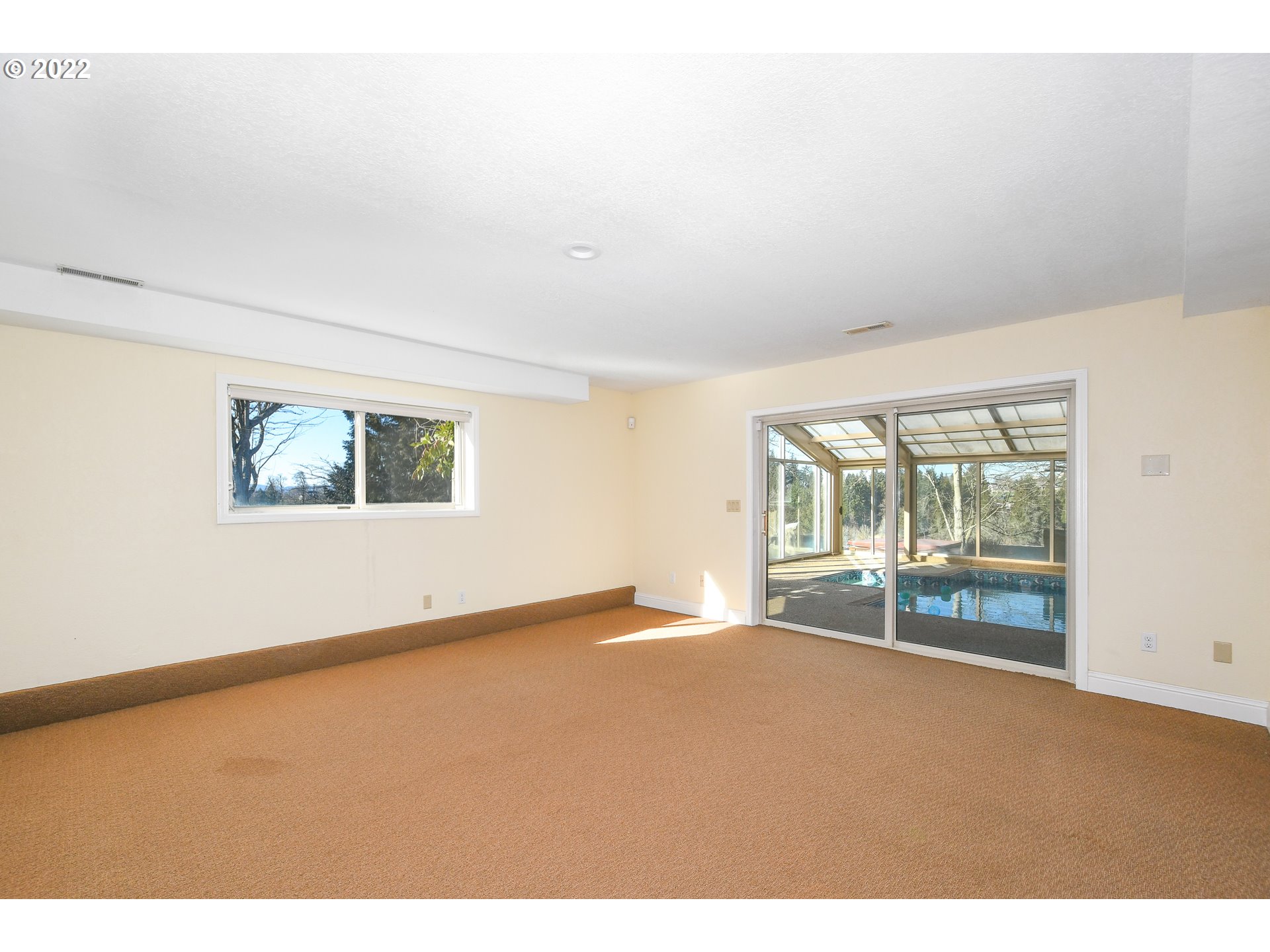 18604 Northwest 64th Avenue Ridgefield, WA 98642 - Photo 25 of 32 an empty room with floor to ceiling window