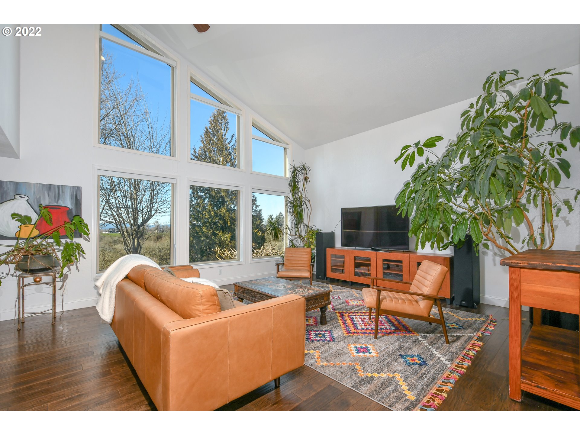 18604 Northwest 64th Avenue Ridgefield, WA 98642 - Photo 3 of 32 a living room with furniture fireplace and a large window