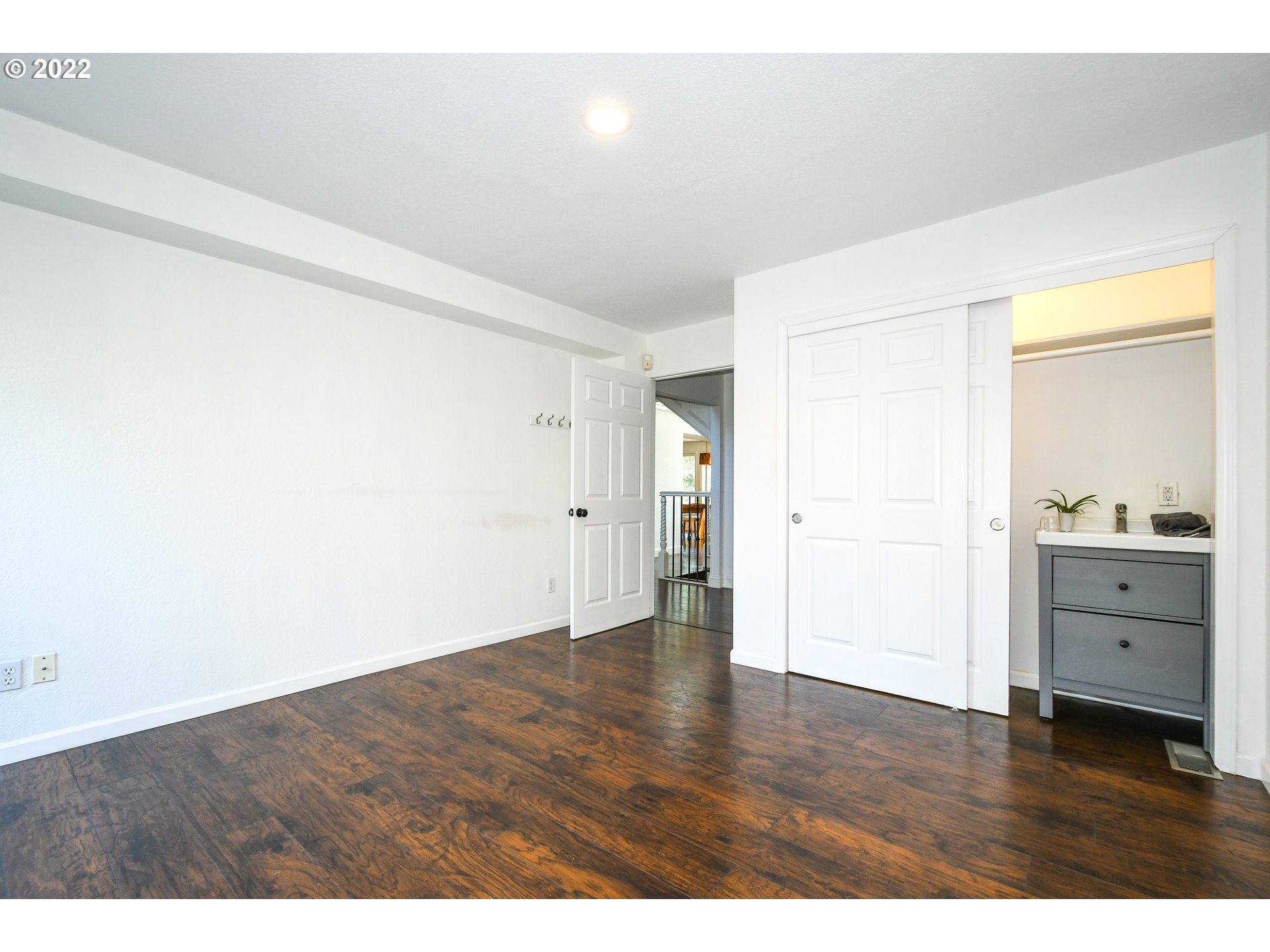 18604 Northwest 64th Avenue Ridgefield, WA 98642 - Photo 10 of 32 a view of an empty room and window and wooden floor