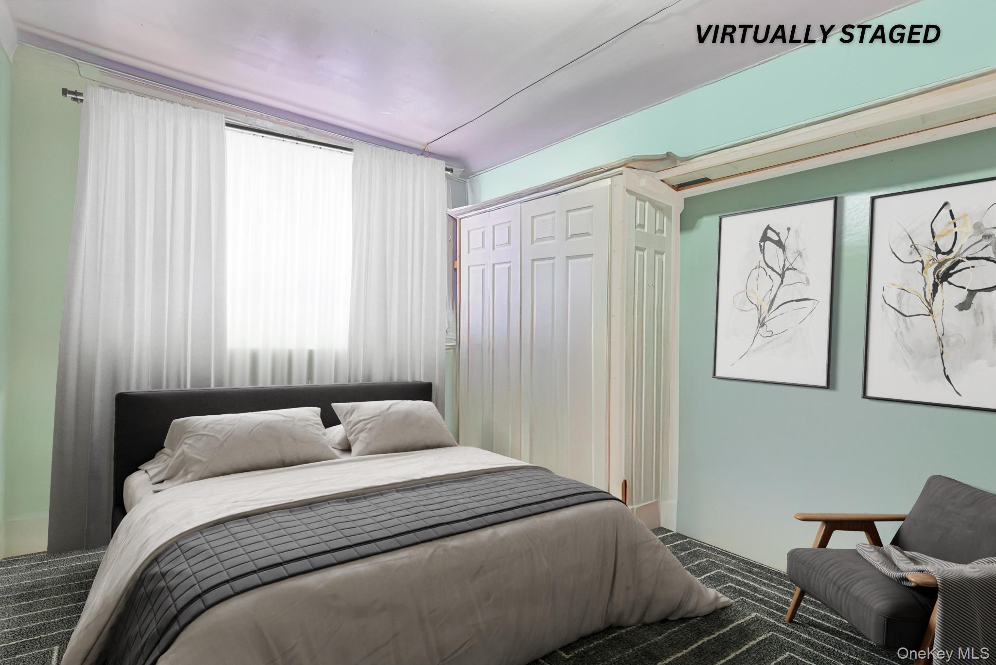 12-16 30th Drive Queens, NY 11102 - Photo 15 of 34 a bedroom with a bed and wooden floor