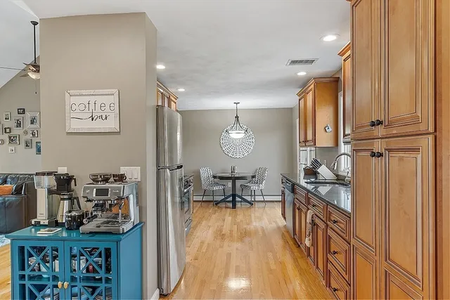 a kitchen with sink cabinets and stove