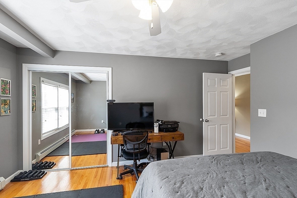 159 Judge Road Lynn, MA 01904 - Photo 18 of 41 a bedroom with a bed and a flat screen tv