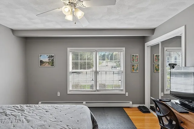 a bedroom with bed and window