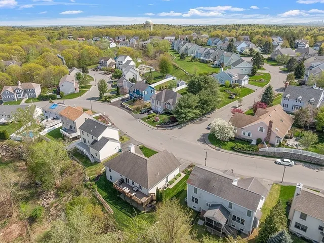an aerial view of residential houses with outdoor space