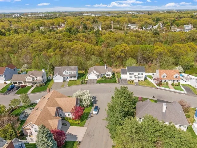 an aerial view of residential houses with outdoor space