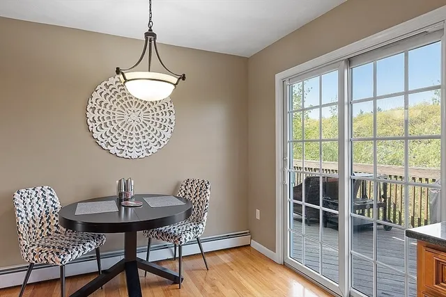 a room with a chandelier and windows