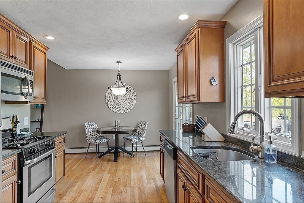 159 Judge Road Lynn, MA 01904 - Photo 10 of 41 a kitchen with granite countertop a stove a sink and cabinets