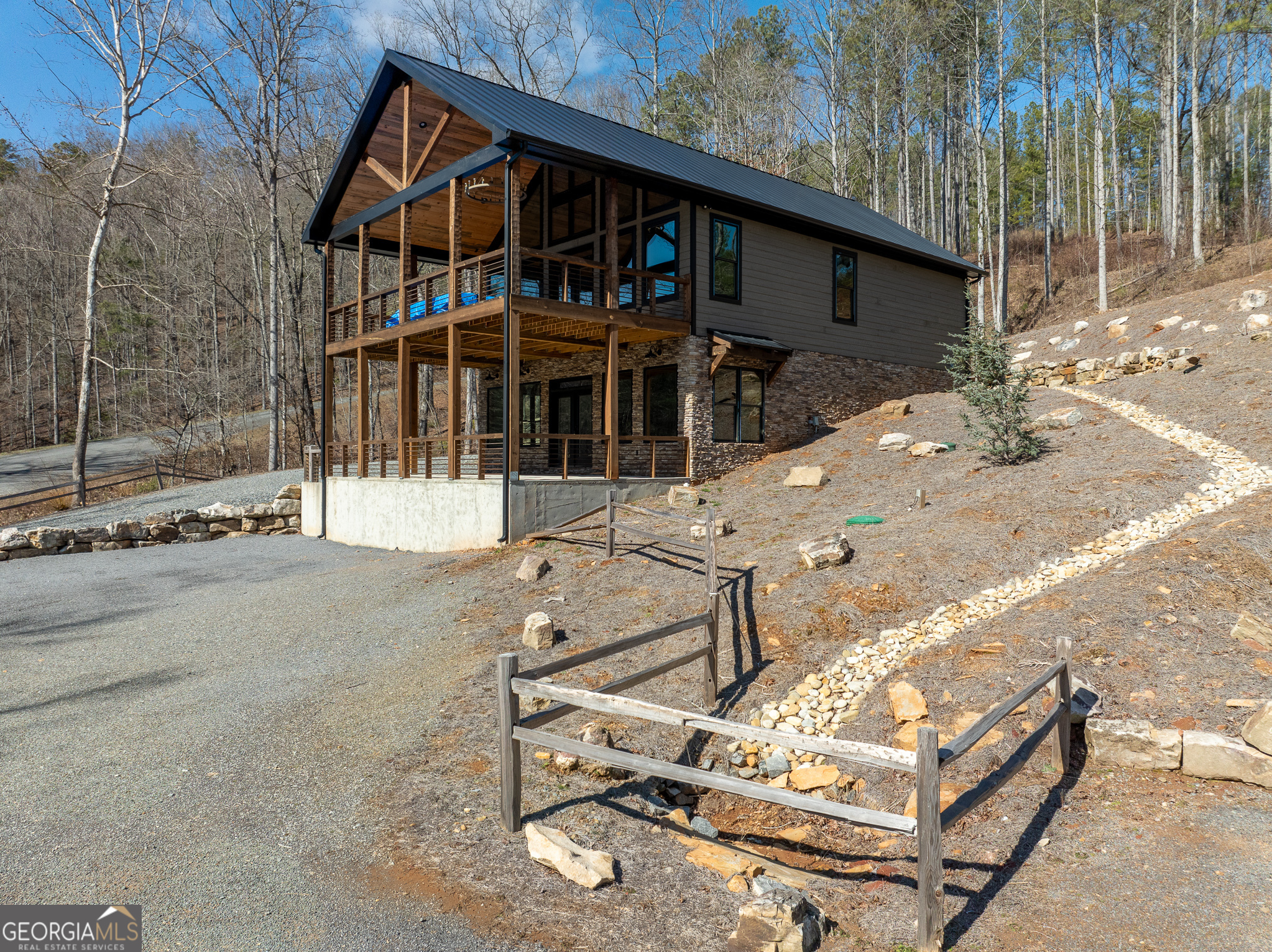 Lot 127 Red Hawk Lane Ellijay, GA 30540 - Photo 20 of 35 a view of a house with wooden deck