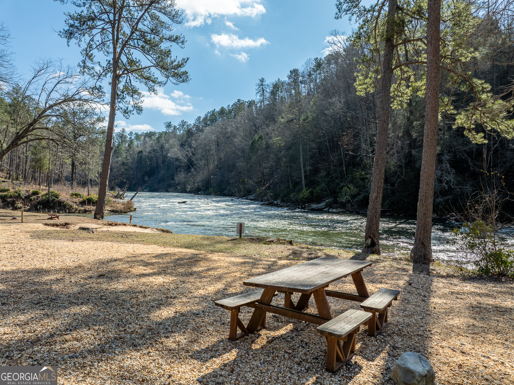Lot 127 Red Hawk Lane Ellijay, GA 30540 - Photo 22 of 35 a view of swimming pool with lawn chairs under an umbrella