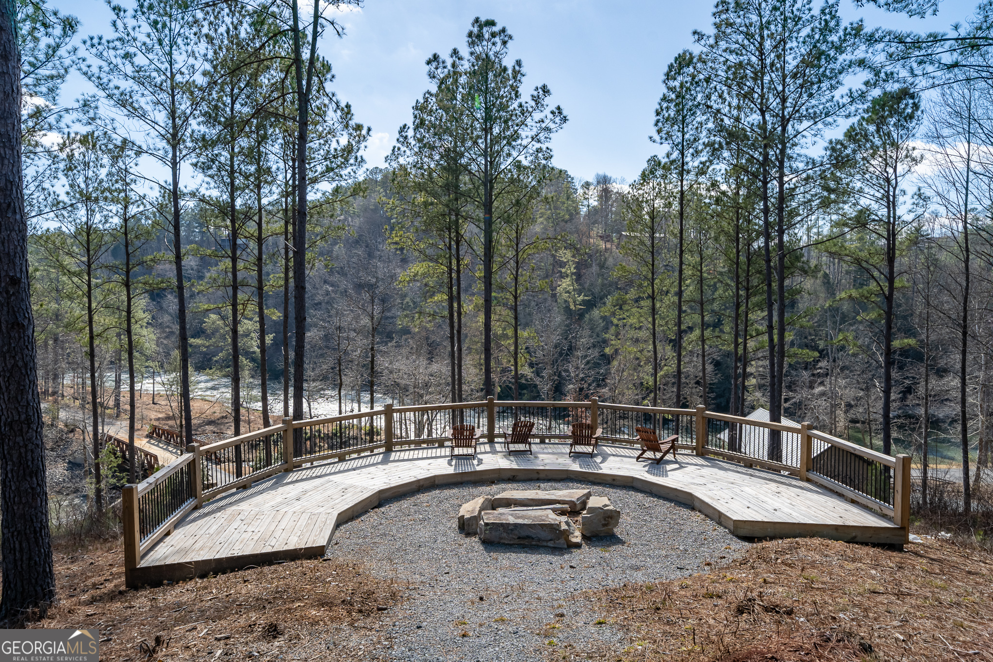 Lot 127 Red Hawk Lane Ellijay, GA 30540 - Photo 34 of 35 a view of a swimming pool with a patio and wooden fence
