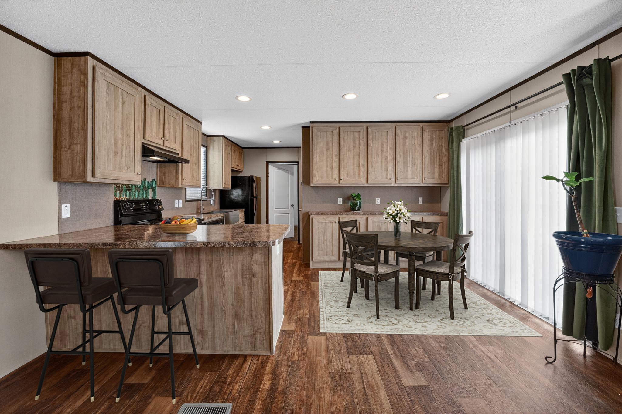 16 4th Street Maxwell, TX 78656 - Photo 24 of 35 a kitchen with a dining table chairs and refrigerator