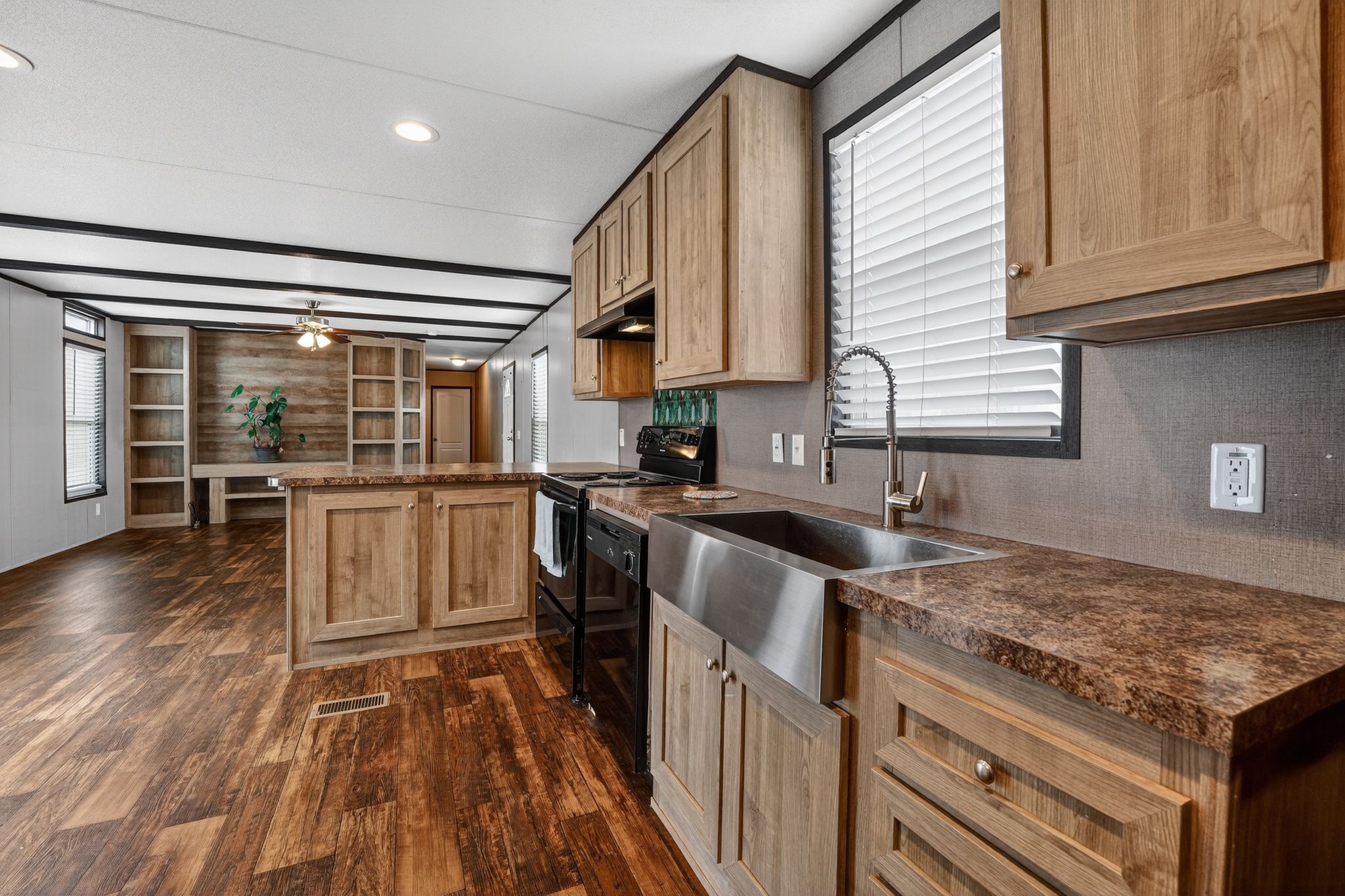 16 4th Street Maxwell, TX 78656 - Photo 26 of 35 a kitchen with stainless steel appliances granite countertop a stove and a sink