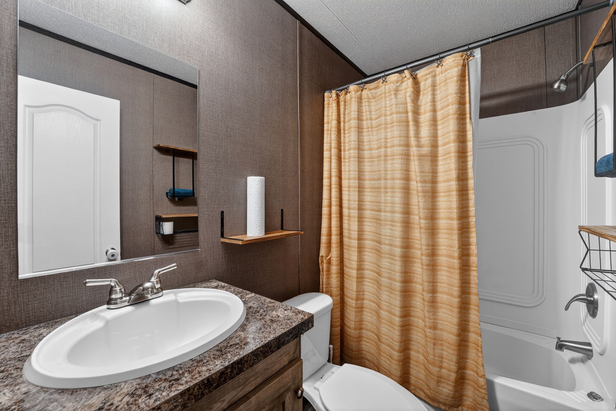 16 4th Street Maxwell, TX 78656 - Photo 30 of 35 a bathroom with a sink toilet and shower