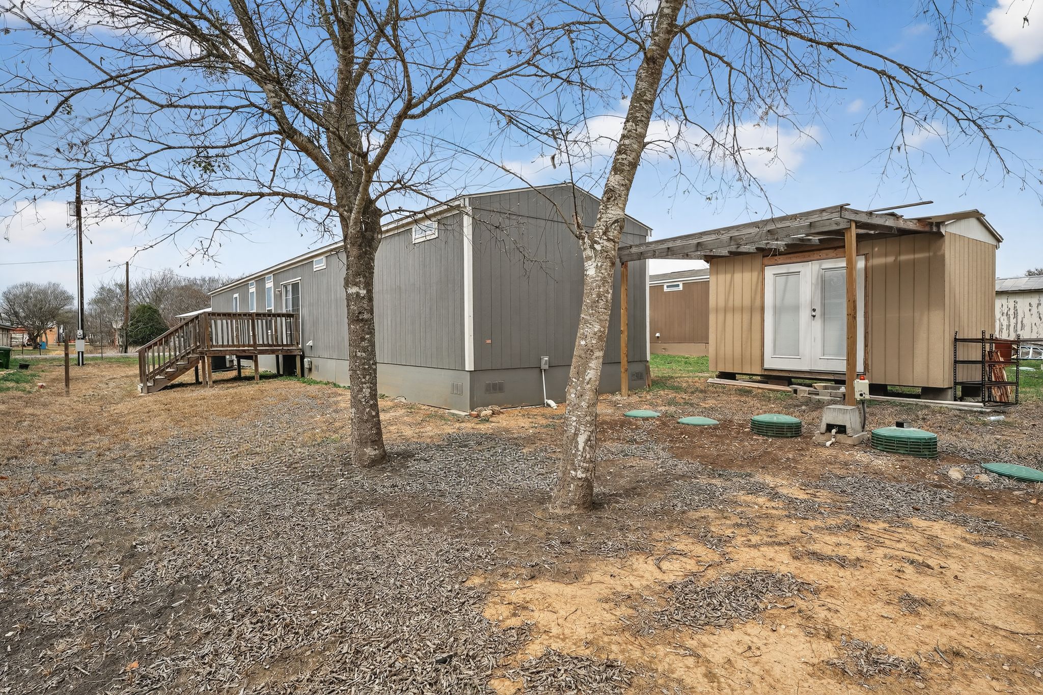 16 4th Street Maxwell, TX 78656 - Photo 3 of 35 a view of a house with a backyard