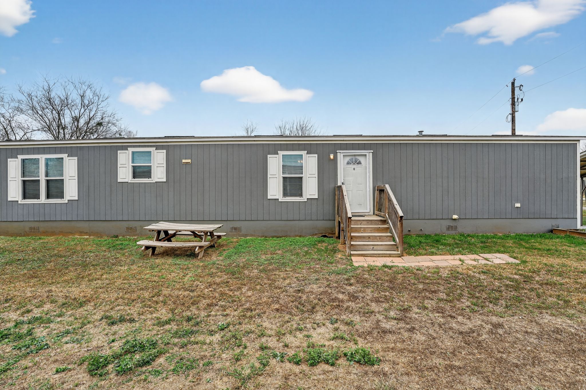 16 4th Street Maxwell, TX 78656 - Photo 4 of 35 a backyard of a house with table and chairs