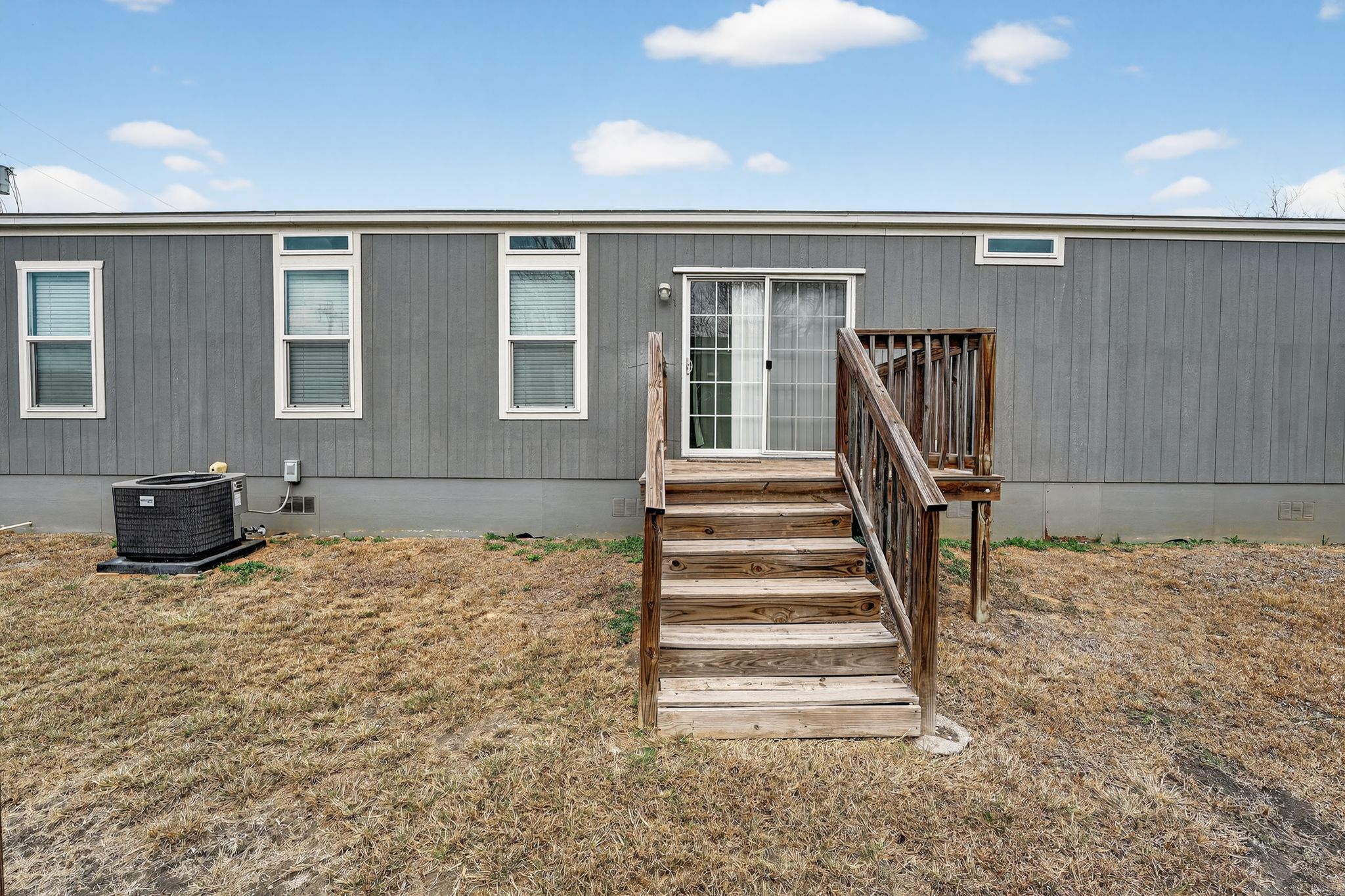 16 4th Street Maxwell, TX 78656 - Photo 5 of 35 a view of a livingroom with a flesh screen tv and stairs