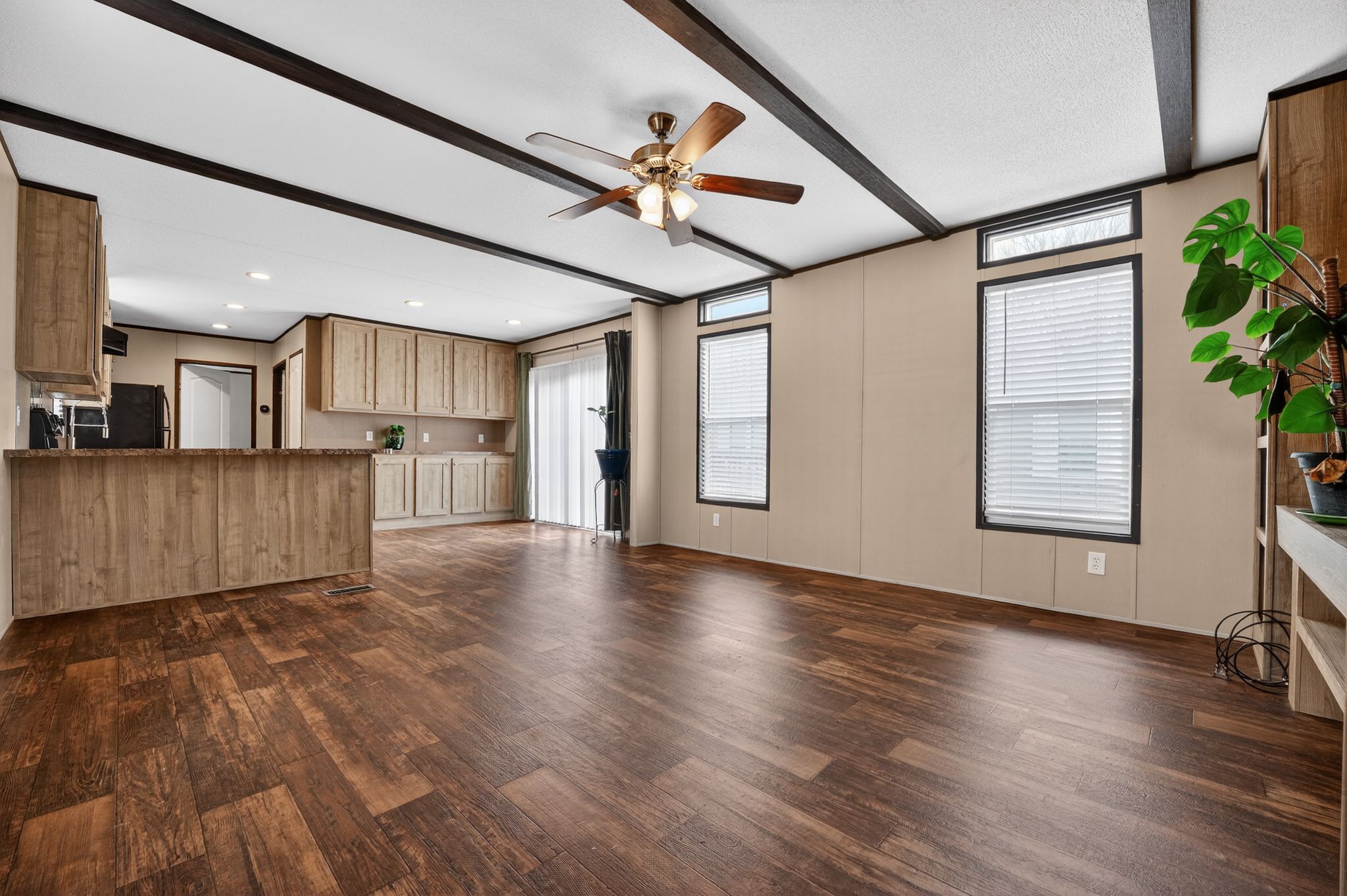 16 4th Street Maxwell, TX 78656 - Photo 10 of 35 a view of a kitchen with a dishwasher and wooden floor