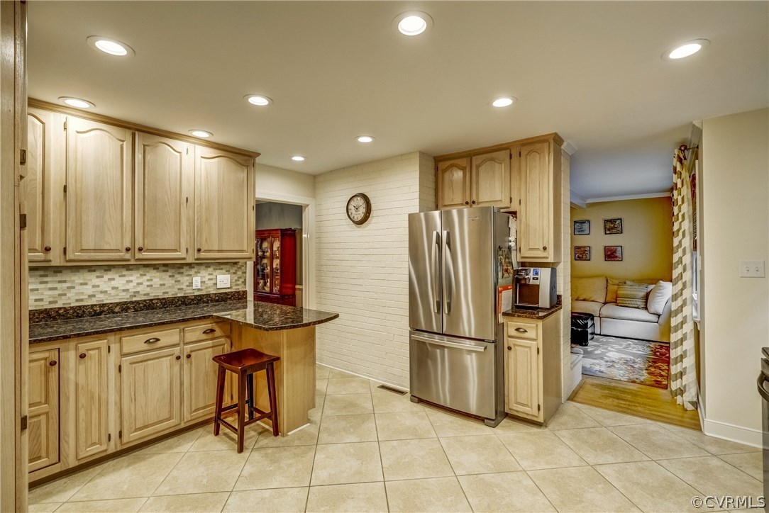 3901 Cheyenne Road Richmond, VA 23235 - Photo 13 of 49 a kitchen with stainless steel appliances granite countertop a refrigerator and a stove top oven with white cabinets