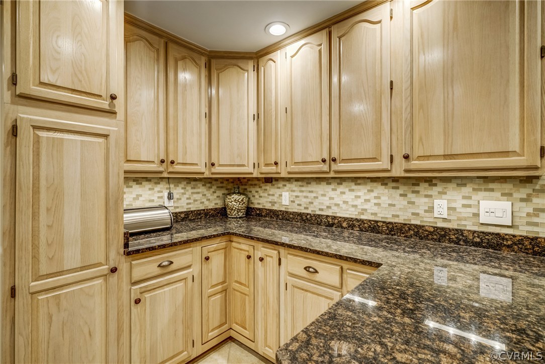 3901 Cheyenne Road Richmond, VA 23235 - Photo 15 of 49 a view of a kitchen with granite countertop cabinets