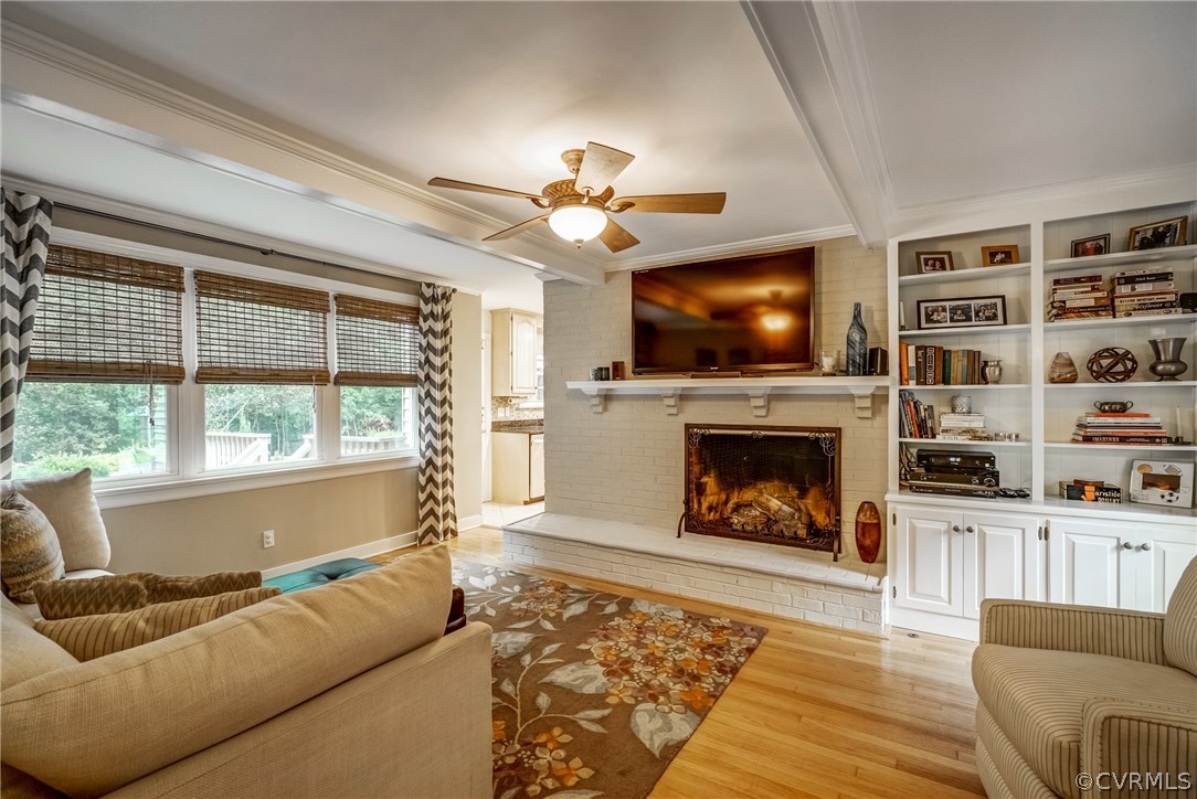 3901 Cheyenne Road Richmond, VA 23235 - Photo 18 of 49 a living room with furniture a fireplace and a flat screen tv