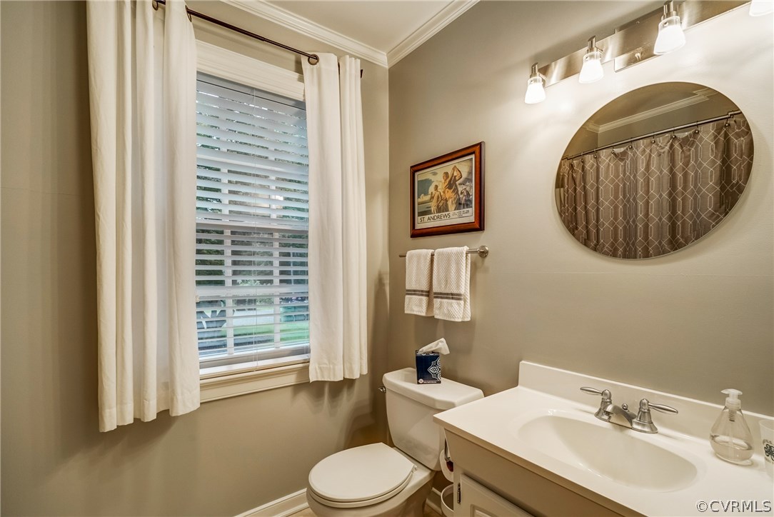 3901 Cheyenne Road Richmond, VA 23235 - Photo 19 of 49 a bathroom with a toilet a sink and mirror