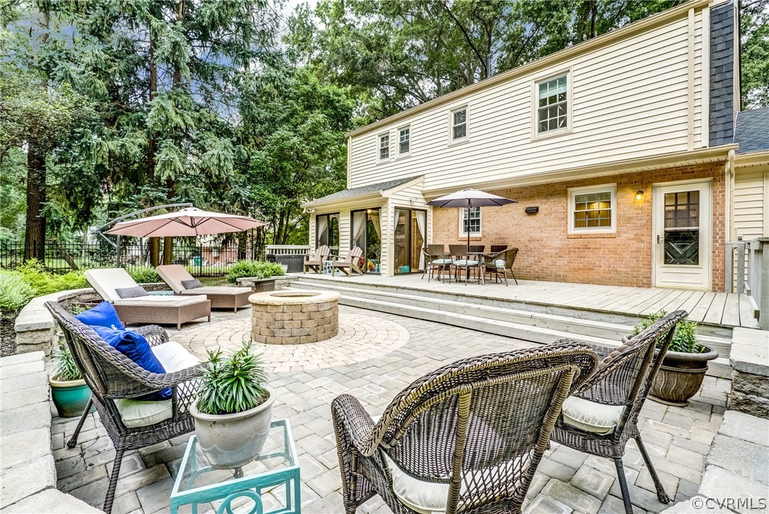 3901 Cheyenne Road Richmond, VA 23235 - Photo 39 of 49 a patio with a table and chairs and potted plants